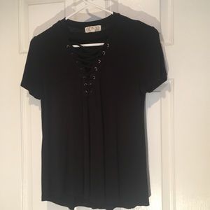 Black short-sleeved top with lace up v neck